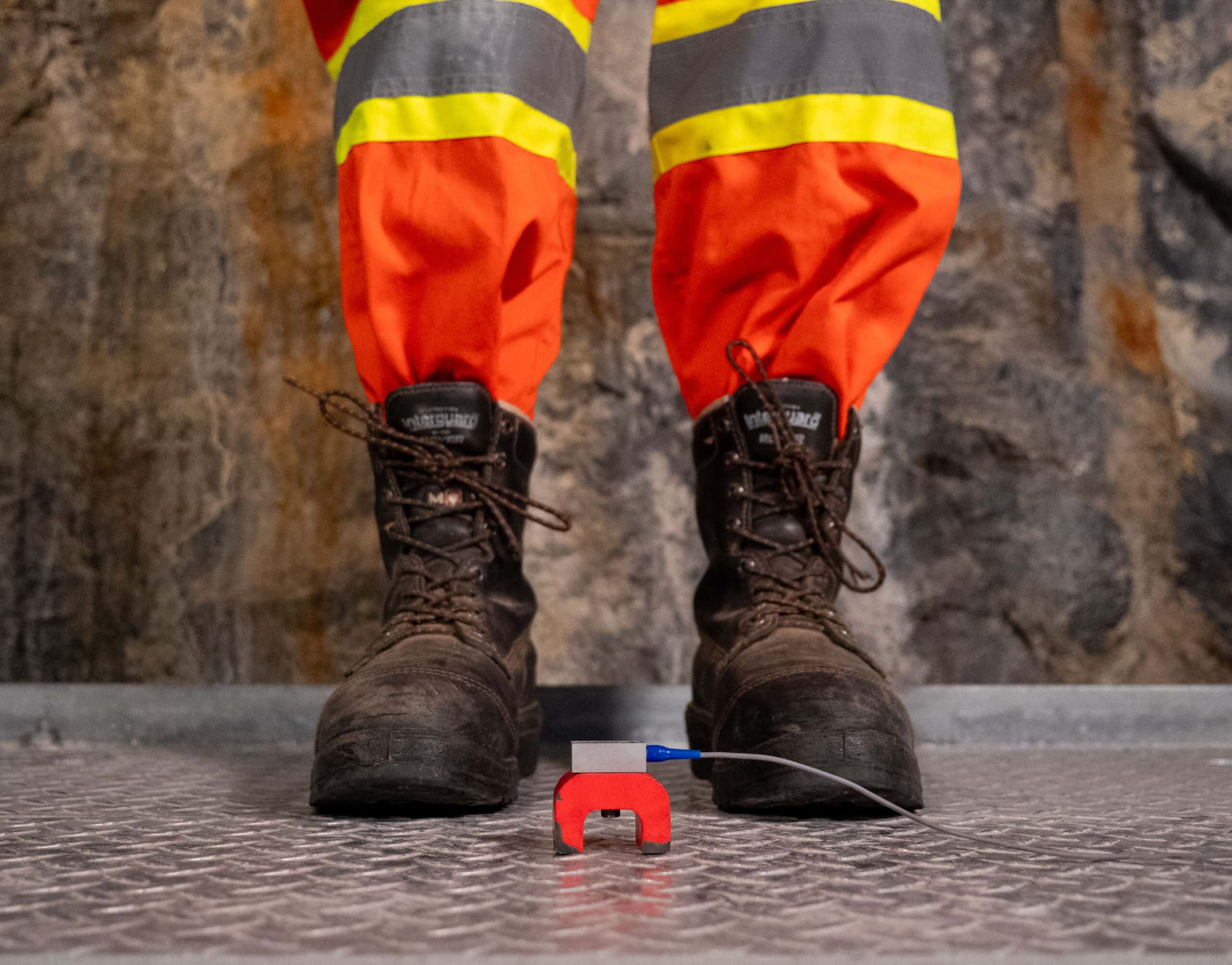 Accelerometer and boots on a metal surface in a mine