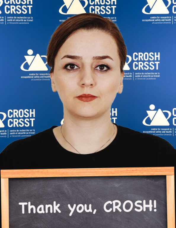 CROSH student member and award winner Elmira Saffarvarkiani with chalkboard that reads "Thank you, CROSH!"